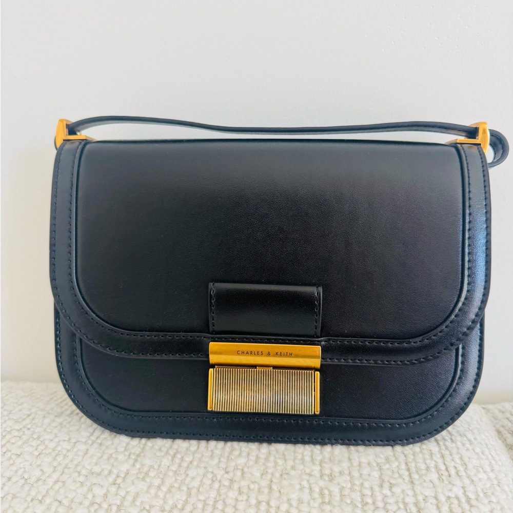 Charles & Keith Black Crossbody Bag with Gold Accent